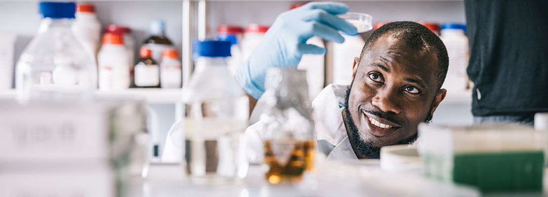 Black male forensic expert working in Regina lab.