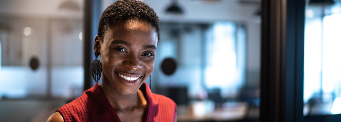 Young professional smiles at camera